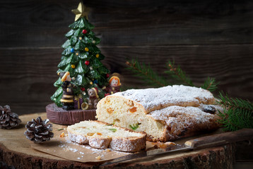 Christmas cake with candied fruits. Stollen is a traditional German cake on the stump.