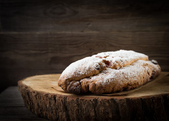 Christmas cake with candied fruits. Stollen is a traditional German cake on the stump.