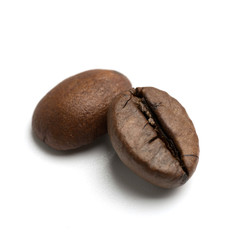 close up of two dark roasted fair trade coffee beans