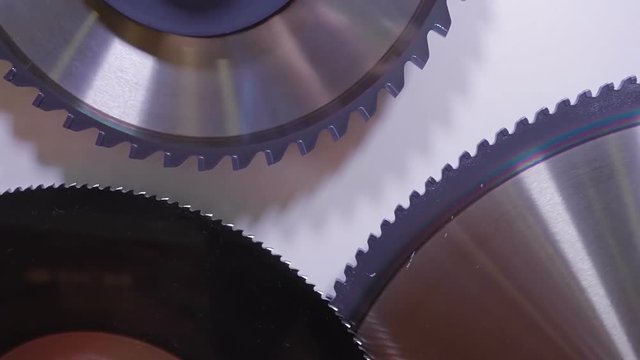 Set of new various blades for different jobs at the sawmill on the white background. Shot in motion