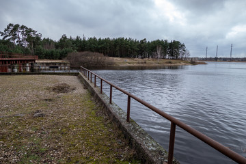 old red metal bridge over water