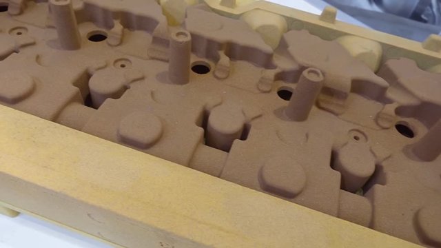 Sand casting is a widely used technology for producing complex shaped parts, such as the head the block of cylinders  of an engine. Shot in motion