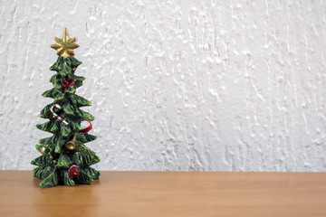 Christmas tree on a wooden table with a white background