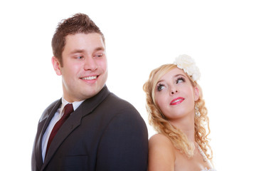 Happy groom and bride posing for marriage photo