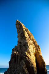 Rock formations in the late afternoon on El Matator State Beach in Malibu, California
