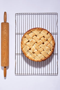 Apple pie with lattice work and rolling pin