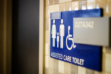 Airport assisted care toilet sign