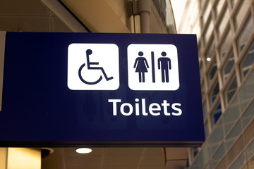 Toilet and wheelchair airport sign