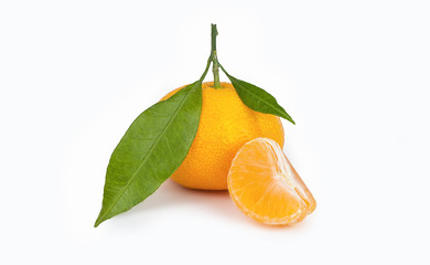 yellow sweet isolated peeled and whole mandarin clementine tangerine on white copy space with leaf. Tangerines background concept
