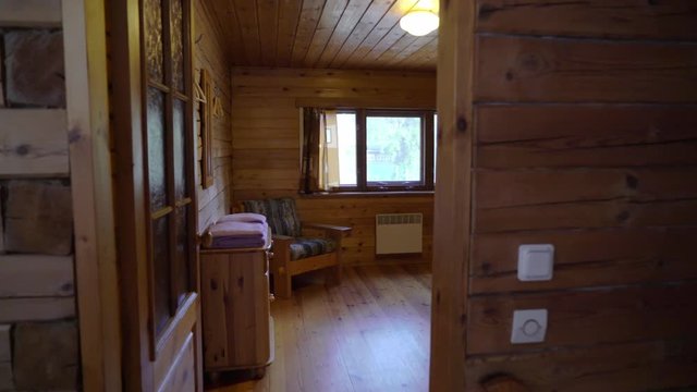A wooden cottage indoors. Luxury house for vacations interior. Bedroom or room at countryside or village