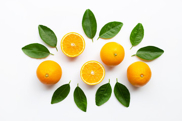 Oranges and green leaves on white background.