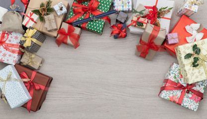 Text or logo empty copy space in vertical top view wooden table full of christmas or birthday gifts presents.Xmas winter holiday season party social media card background 