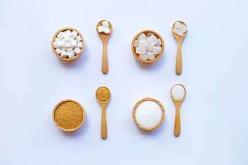 Various types of sugar on white background.