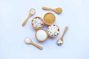 Various types of sugar on white background.