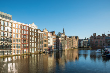Fototapeta na wymiar Amsterdam city view of Netherlands traditional houses with Amstel river in Amsterdam, Netherlands