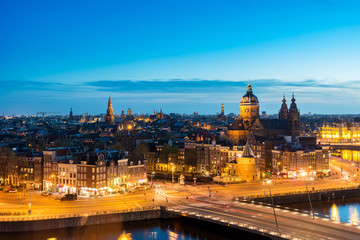 Fototapeta na wymiar Amsterdam skyline in historical area at night, Netherlands. Ariel view of Amsterdam, Netherlands.