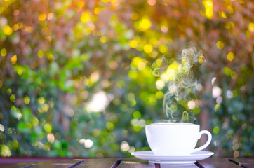 Cup of coffee on table in cafe ,Morning time ,morning light.