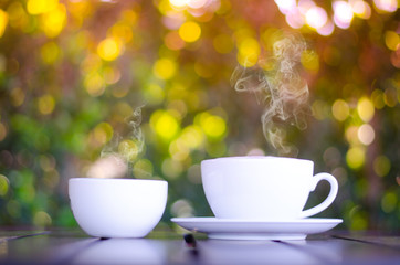 Cup of coffee on table in cafe ,Morning time ,morning light.