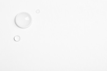 Water drops on white background, top view. Space for text