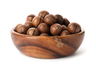Bowl with organic Macadamia nuts on white background