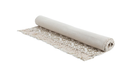 Rolled carpet with ornament on white background. Interior element