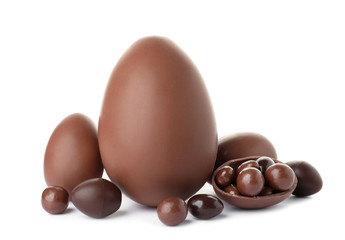 Tasty chocolate Easter eggs on white background