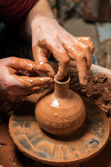 Potter at work. Workshop place.