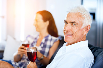 Portrait of a couple having a glass of red wine
