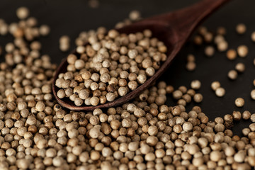 Aromatic peas in a spoon, spices.