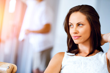 Happy young woman with cup of tea or coffee