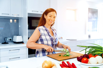Beautiful woman standing in the kitchen