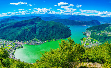 Fototapeta na wymiar Marrogia village and bridge over Lugano lake in Switzerland