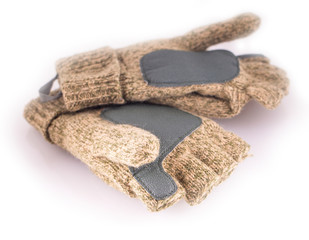 Sports Knitted mitten from a rough wool on a white