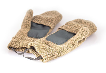 Sports Knitted mitten from a rough wool on a white