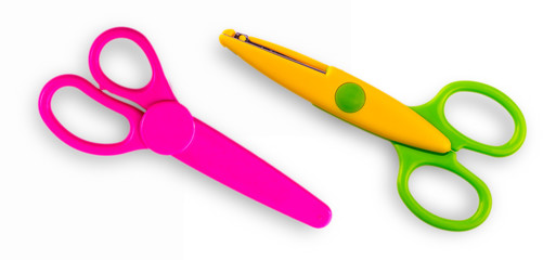 Two baby scissors cut out on a white background. View from above.