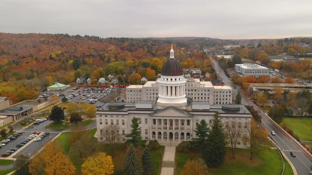 Close to the peak of fall color in the leaves at the State House of Main in Augusta USA