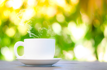 Cup of coffee on table in cafe ,Morning time ,morning light.