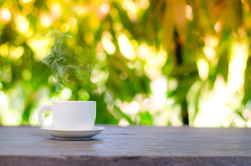 Cup of coffee on table in cafe ,Morning time ,morning light.