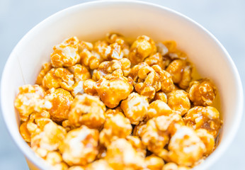 Popcorn in  white cardboard box.