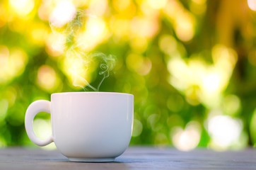 Cup of coffee on table in cafe ,Morning time ,morning light.