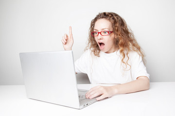 The young woman wearing casual white t-shirt, sitting at her computer - 234808861