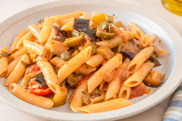 Pasta caponata on a plate close up