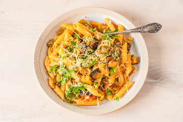Pasta caponata on a plate close up