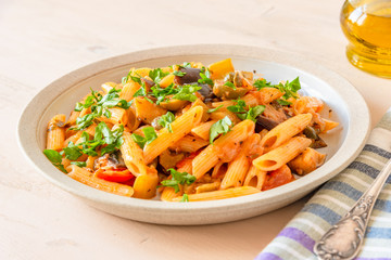 Pasta caponata on a plate close up
