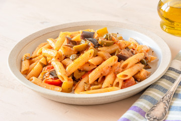 Pasta caponata on a plate close up