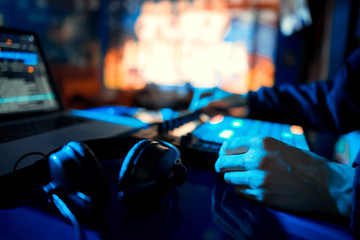 DJ sound equipment at nightclubs and music festivals, EDM, future house music and so on. Parties concept, sound technique. DJ playing on the best