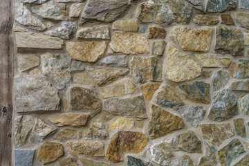 Big stone wall background with wooden plank Amish Country