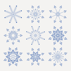 Christmas set of beautiful, fragile snowflakes of blue tint,