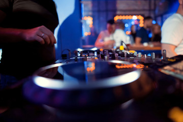 Naklejka premium DJ sound equipment at nightclubs and music festivals, EDM, future house music and so on. Parties concept, sound technique. DJ playing on the best