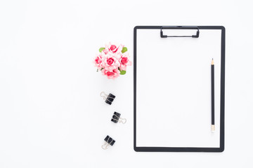 Creative flat lay photo of workspace desk. Top view office desk with pencil and blank clipboard on white color background. Top view with copy space, flat lay photography.